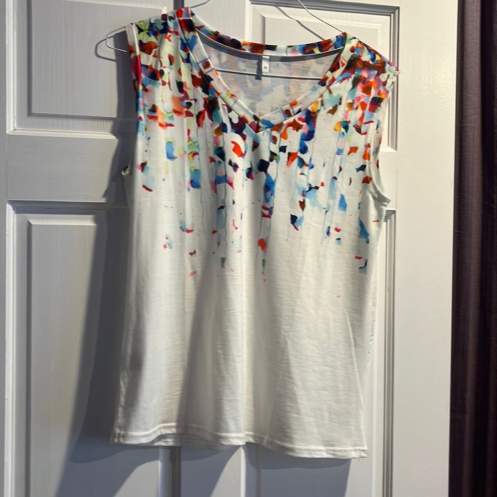 Cute and colorful tank top. Never wore. An ample size medium.
